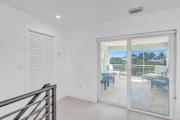 a living room with furniture a couch and a window