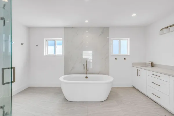 a white room with a sink