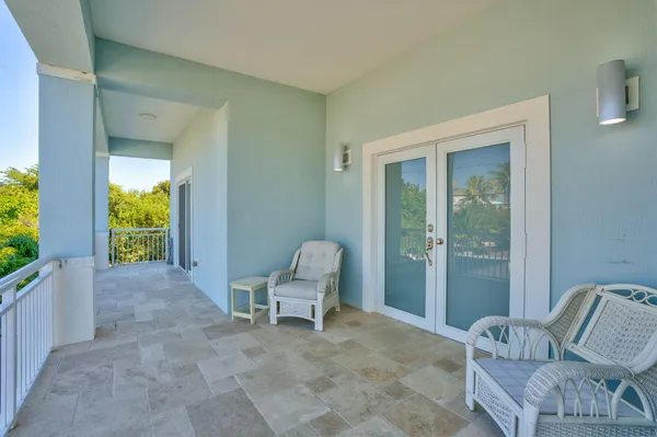 a view of room with furniture and windows