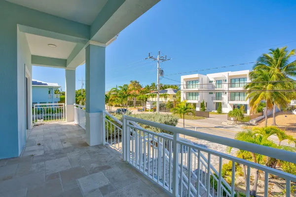 a view of a porch and dining room