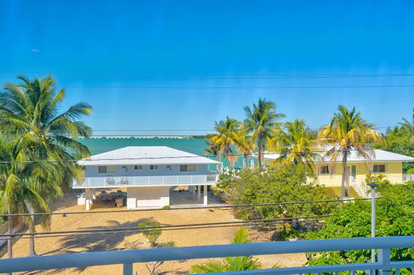 a view of a swimming pool with an outdoor seating
