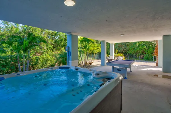 a view of swimming pool from a balcony
