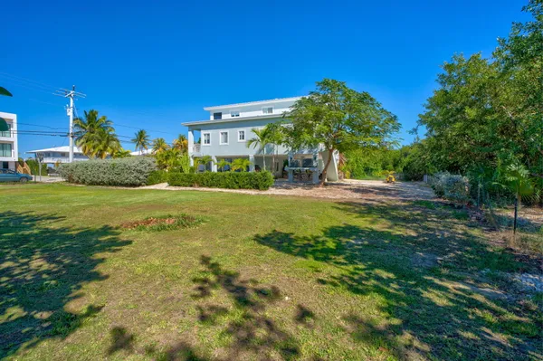 an aerial view of a house with a lake view