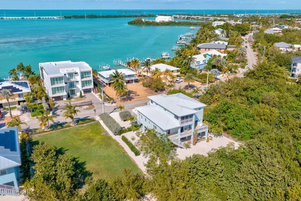 an aerial view of a house with a garden and swimming pool