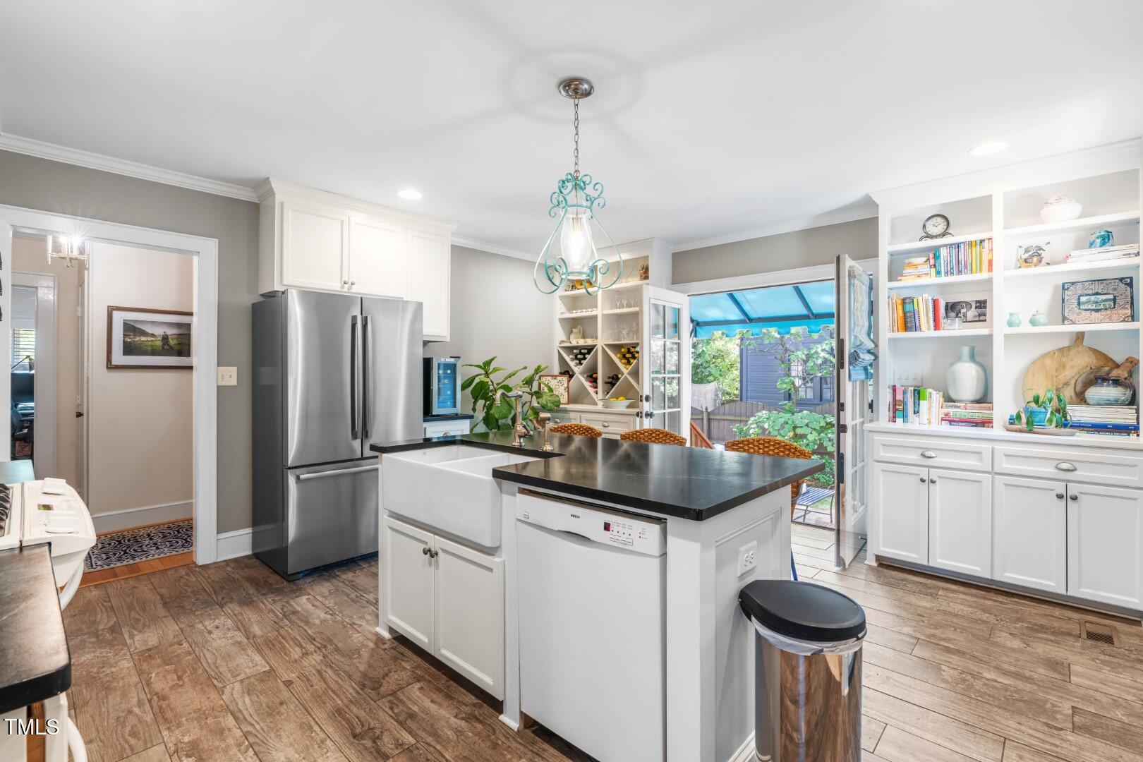 2725 Bedford Avenue Raleigh, NC 27607 - Photo 12 of 48 a kitchen with refrigerator and sink