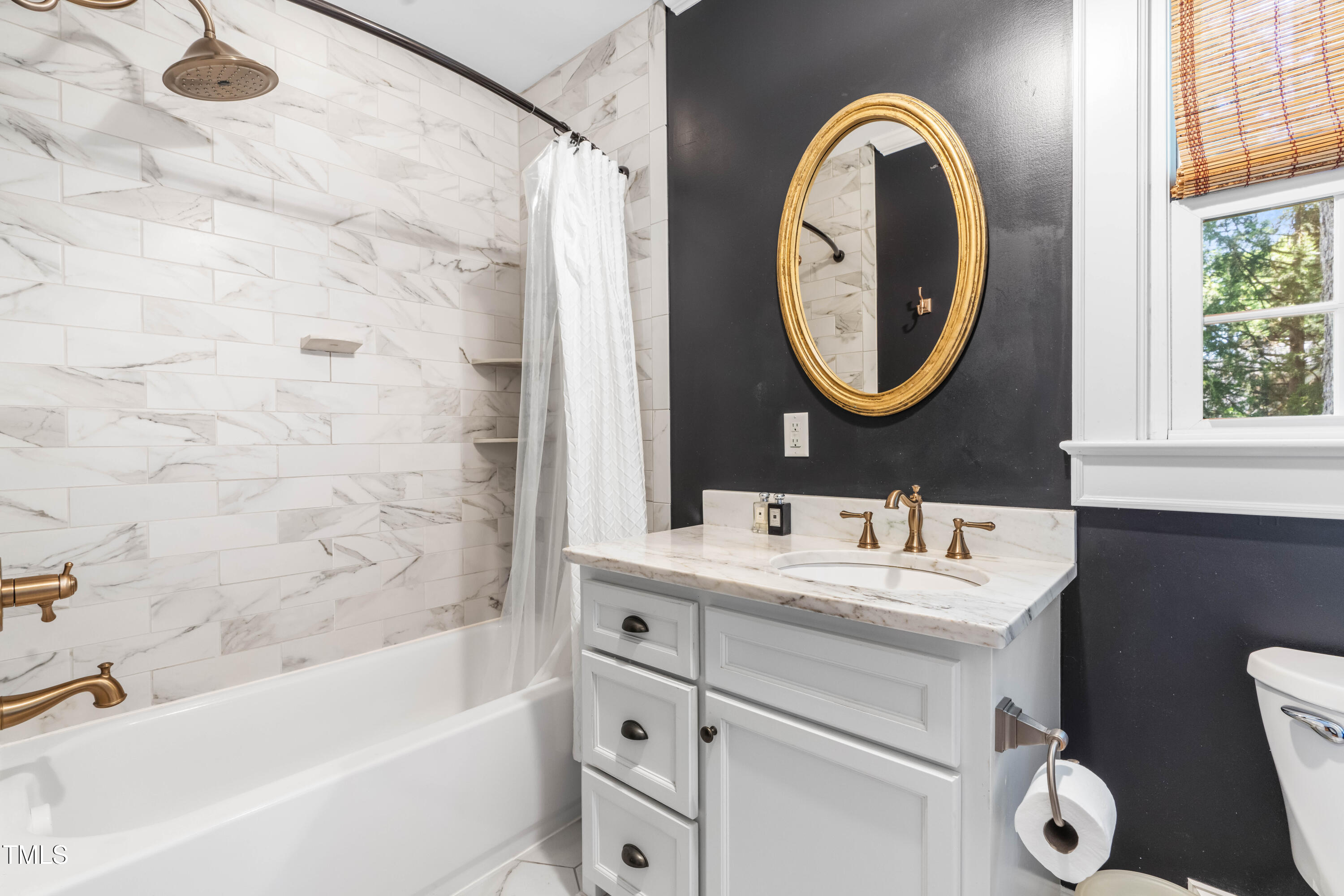 2725 Bedford Avenue Raleigh, NC 27607 - Photo 21 of 48 a bathroom with a sink and a mirror