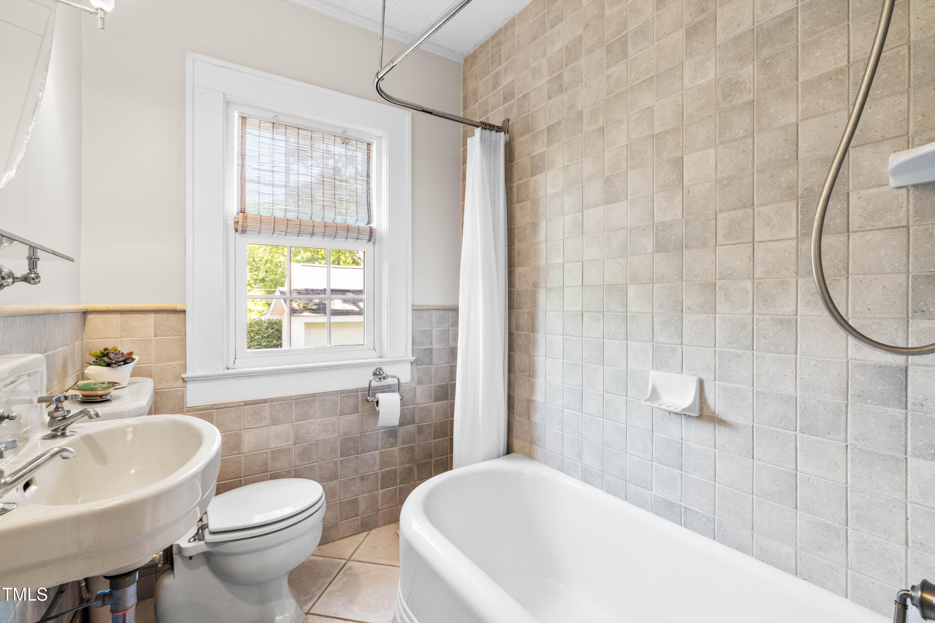 2725 Bedford Avenue Raleigh, NC 27607 - Photo 26 of 48 a bathroom with a sink toilet and shower