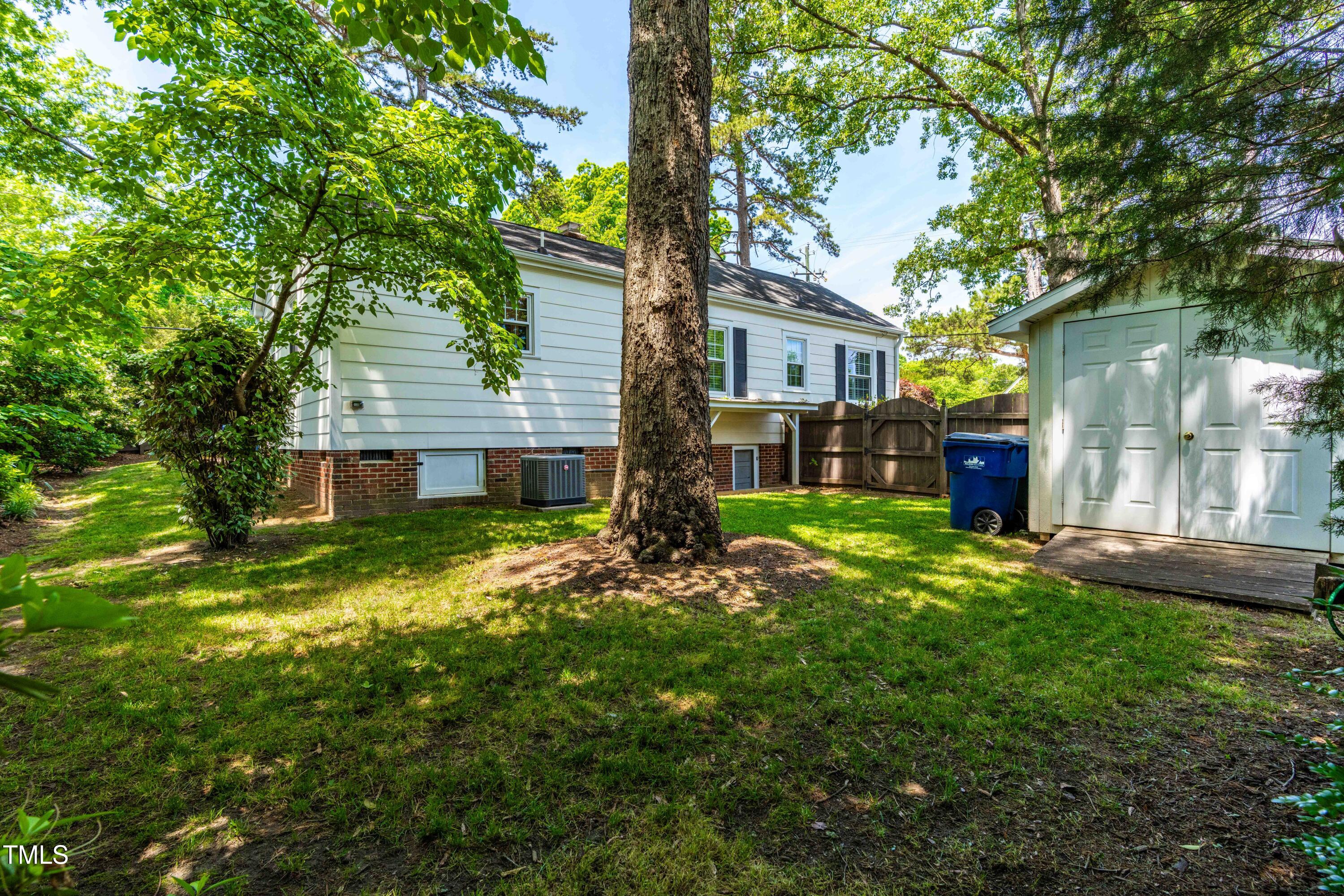 2725 Bedford Avenue Raleigh, NC 27607 - Photo 36 of 48 a brick house with trees in front of it