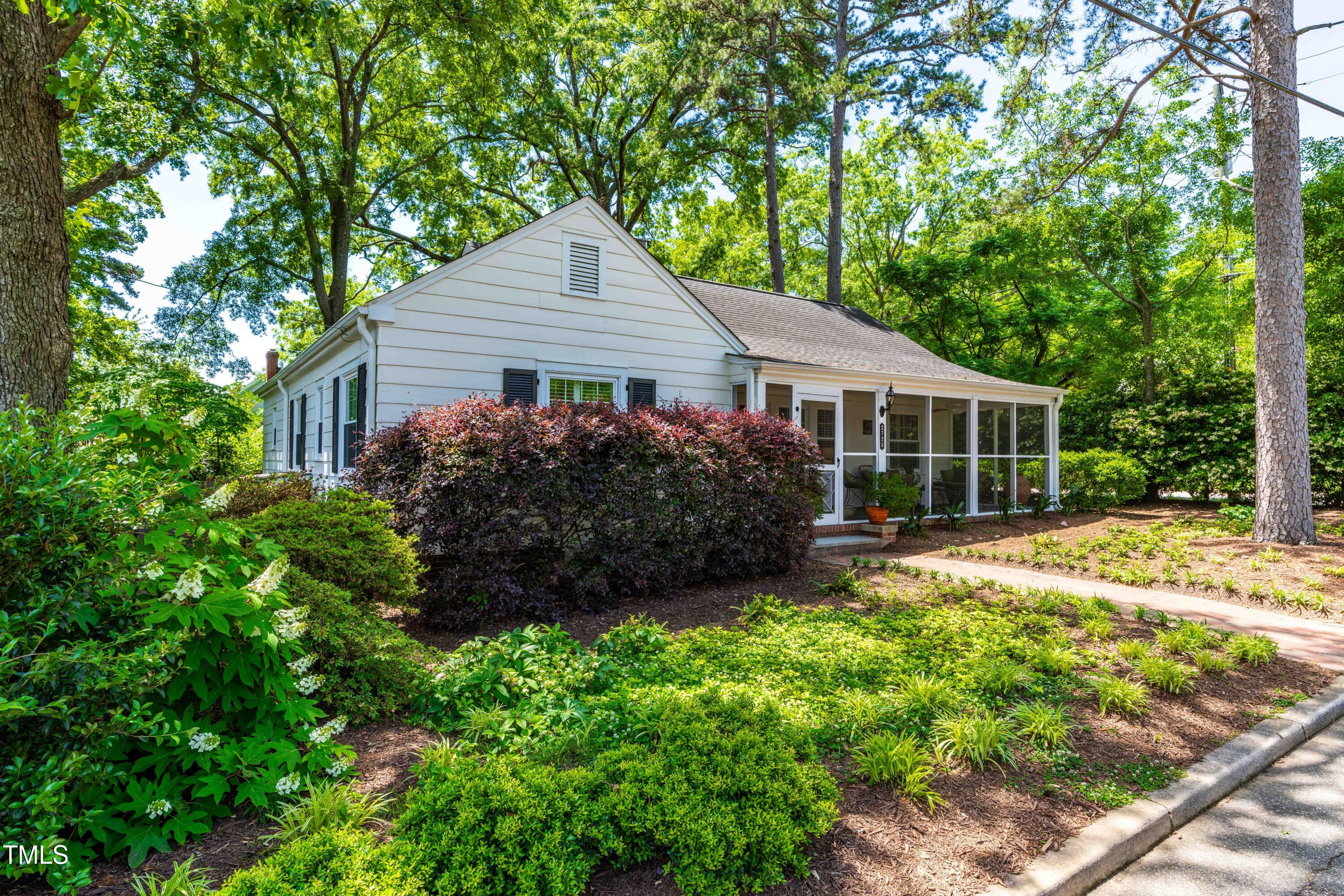 2725 Bedford Avenue Raleigh, NC 27607 - Photo 43 of 48 a house with trees in the background