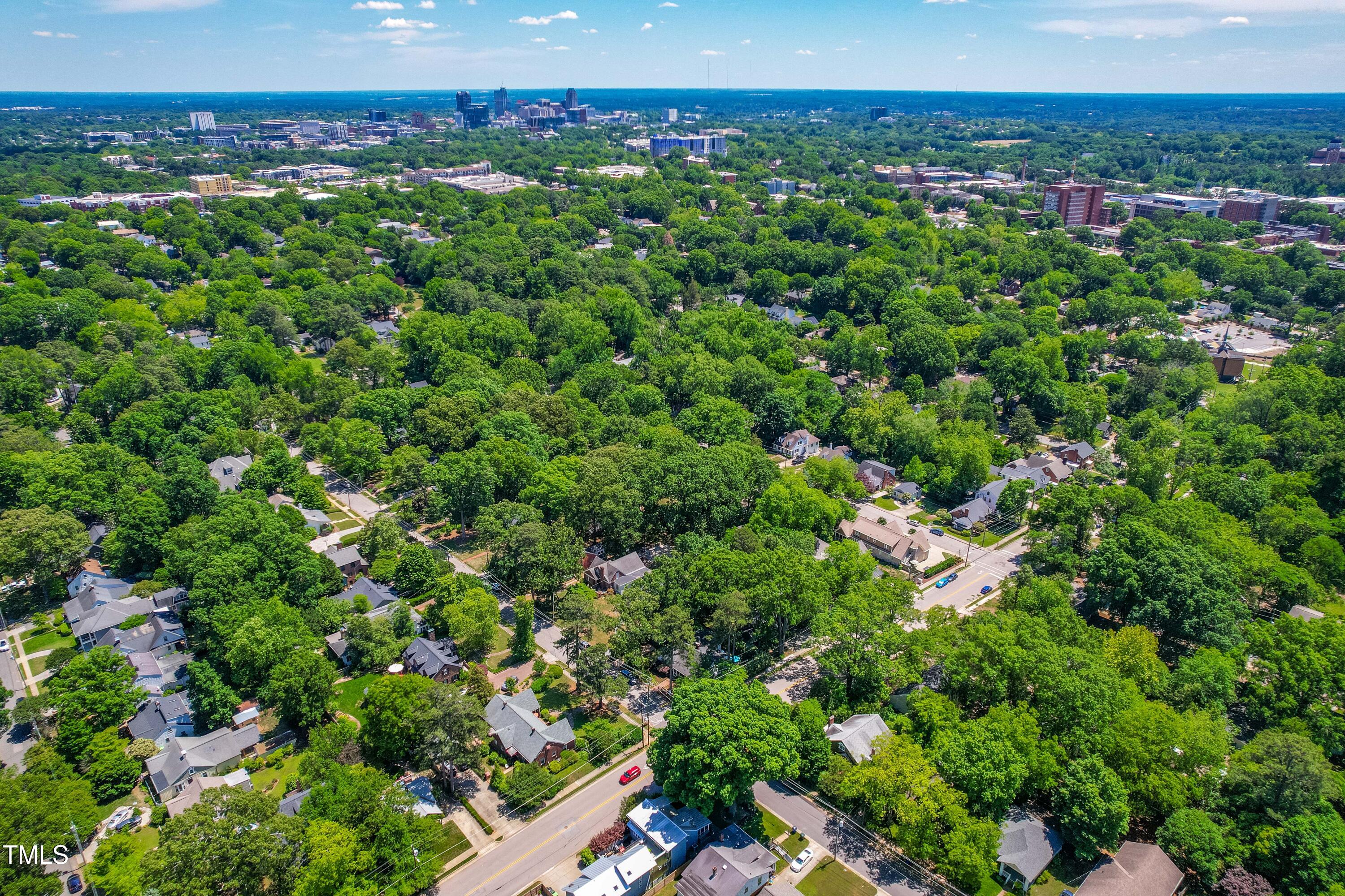 2725 Bedford Avenue Raleigh, NC 27607 - Photo 46 of 48 a view of a city with lush green forest