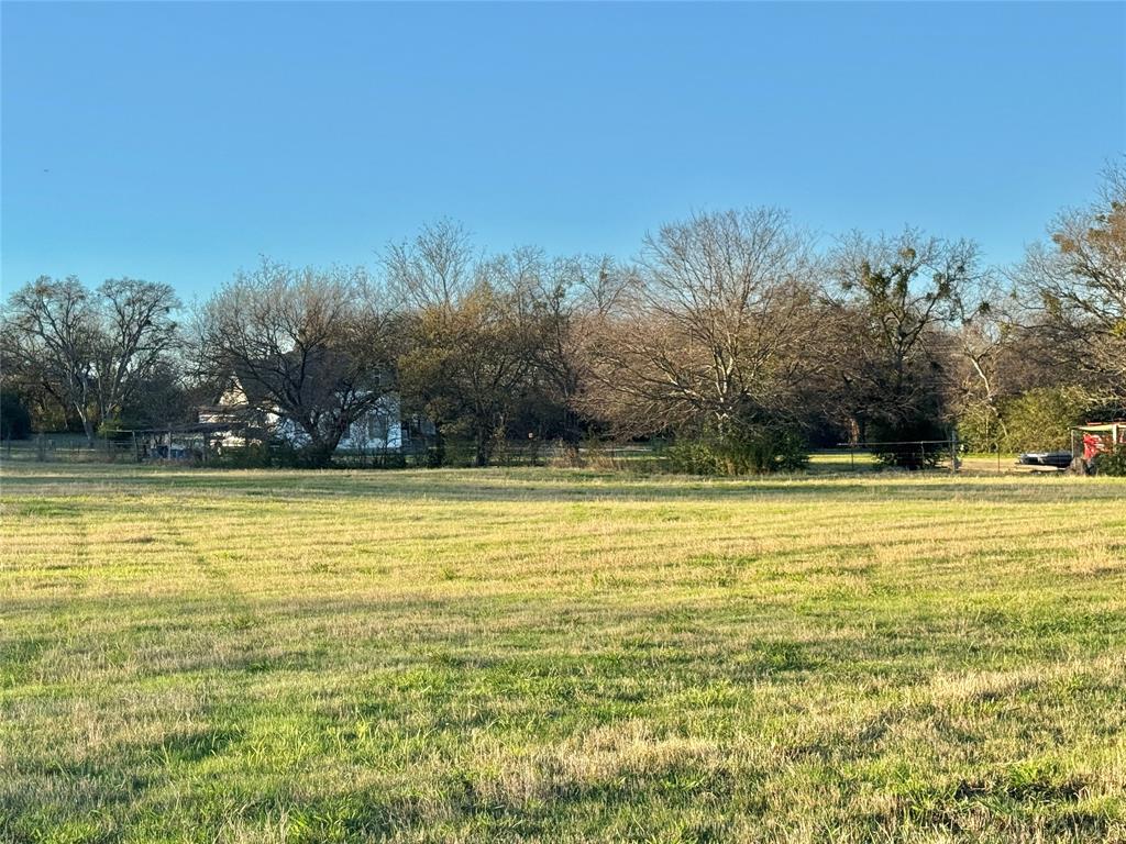 738 Cole Street Gainesville, TX 76240 - Photo 14 of 23 a view of a swimming pool with an outdoor space and seating area