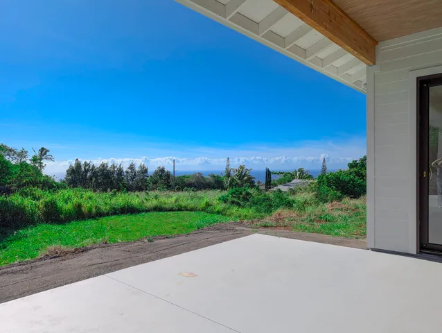 a view of a road with a building in the background