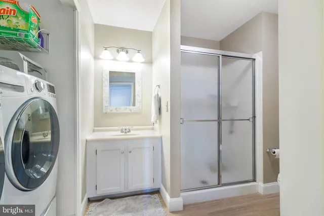 a view of balcony with wooden floor and bench