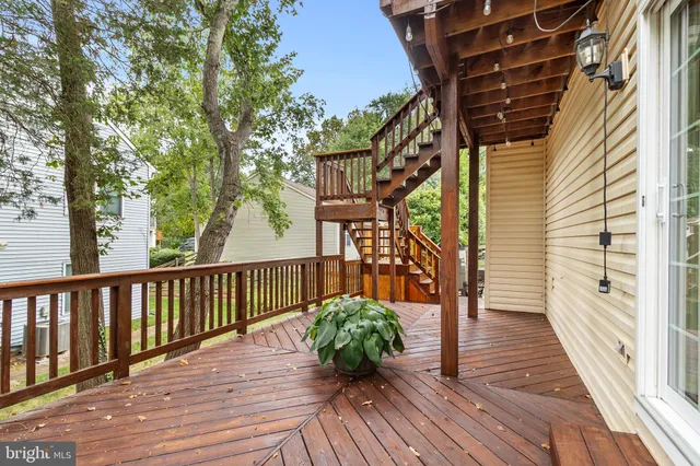 front view of a house with a chairs and table in the patio