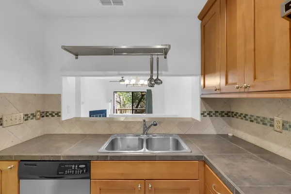 a kitchen with a sink and cabinets