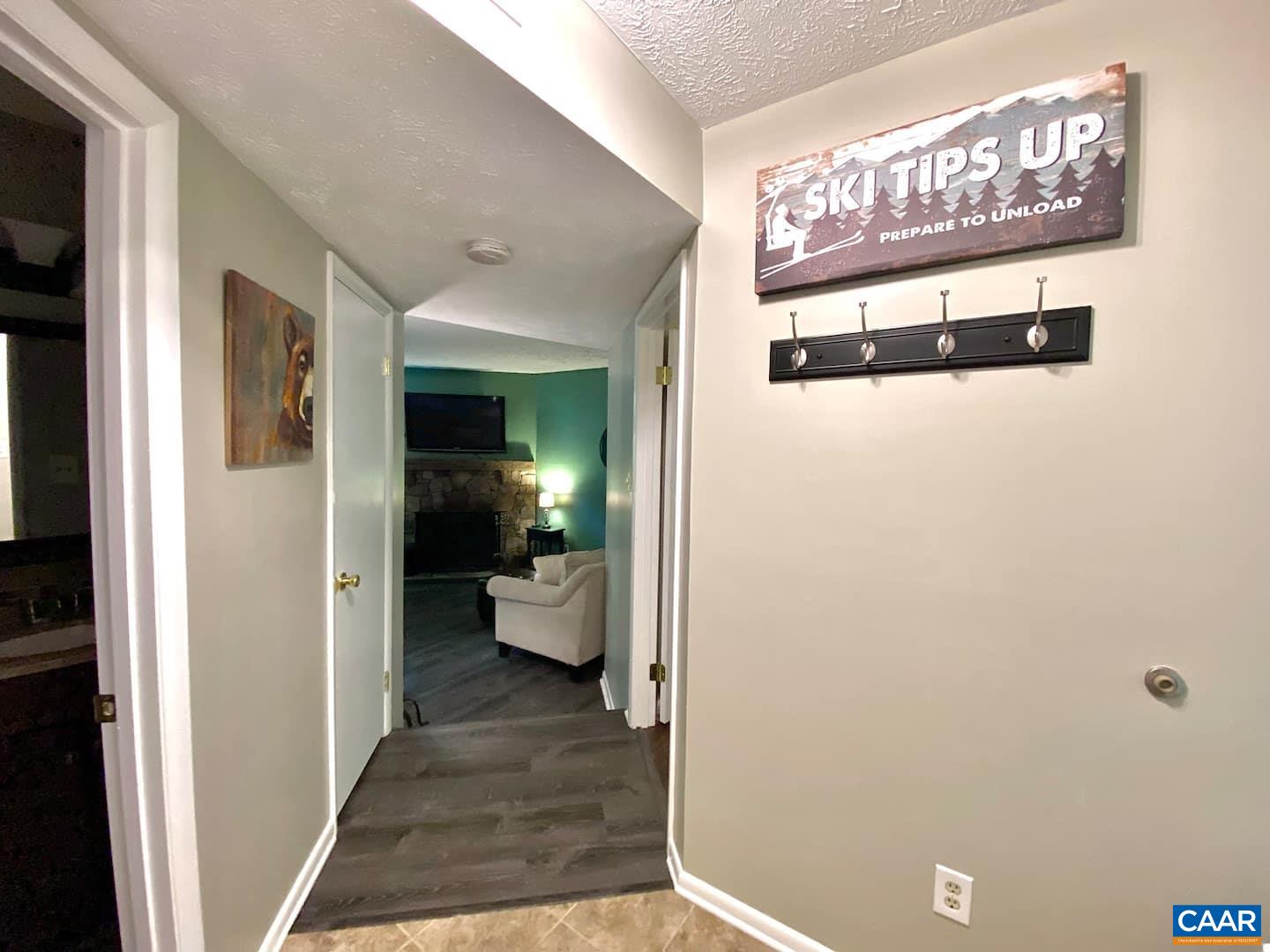 454 3 Ridges Wintergreen, VA 22967 - Photo 9 of 14 a view of a hallway with wooden floor and a living room
