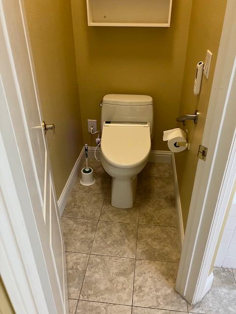 2157 West Rue St Michel Fresno, CA 93711 - Photo 14 of 22 a bathroom with a toilet and a shower