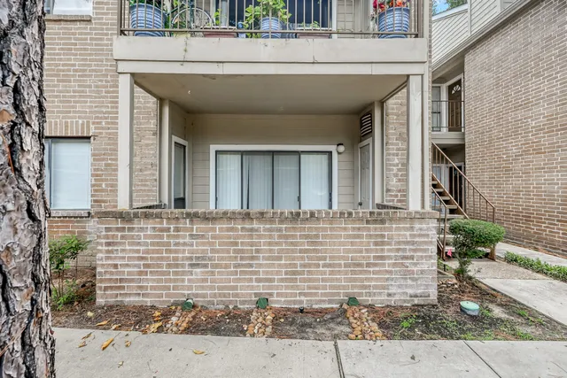a view of a room with window and ceiling fan