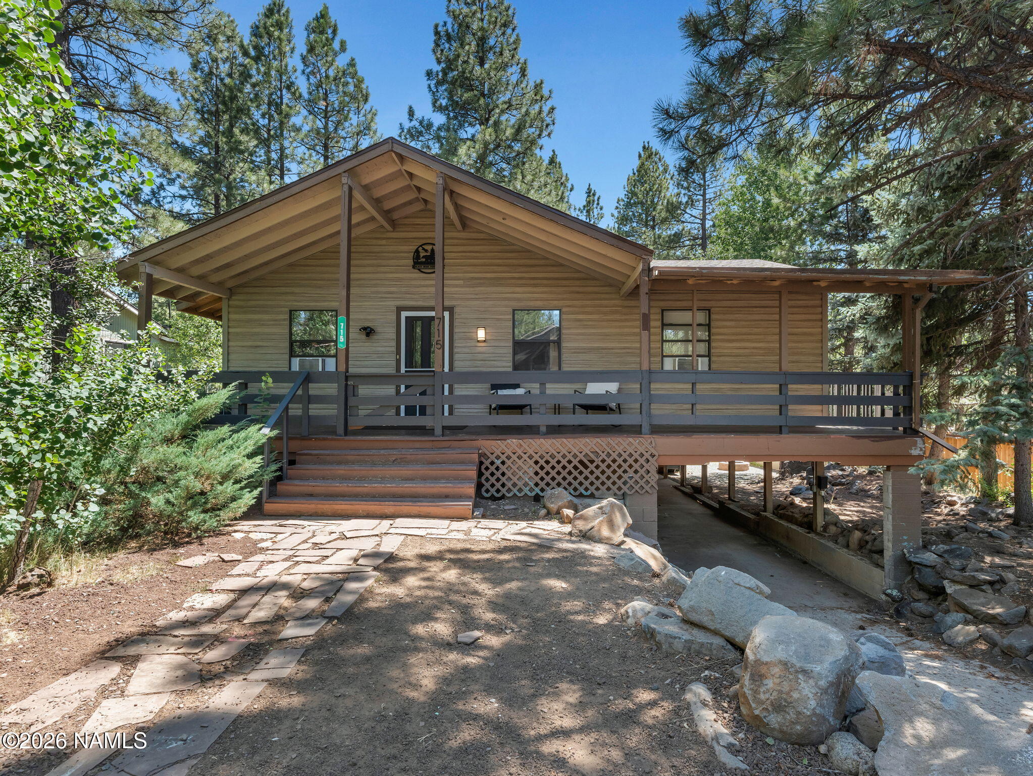 715 Trout Creek Road Munds Park, AZ 86017 - Photo 1 of 46 a front view of house with yard