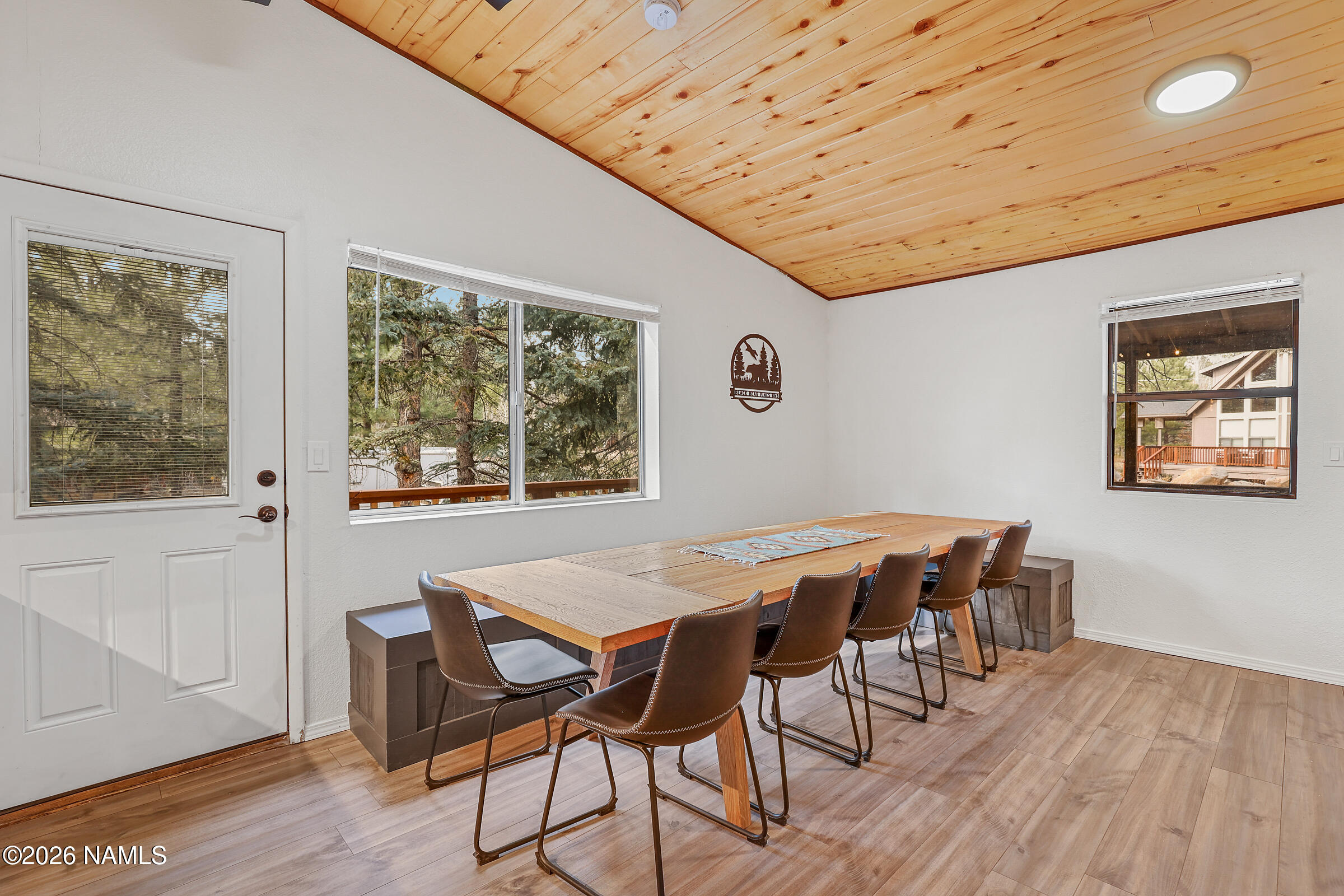715 Trout Creek Road Munds Park, AZ 86017 - Photo 13 of 46 a view of a dining room with furniture window and wooden floor