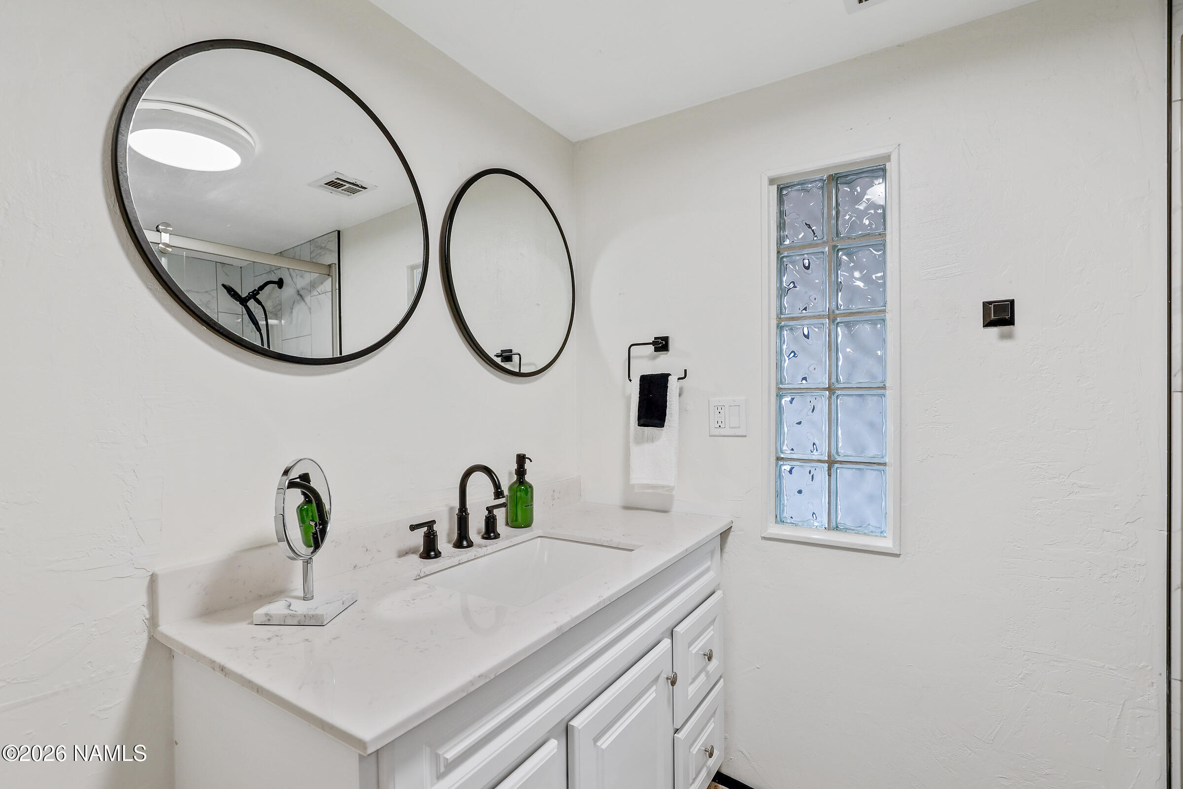 715 Trout Creek Road Munds Park, AZ 86017 - Photo 18 of 46 a bathroom with a sink and a mirror