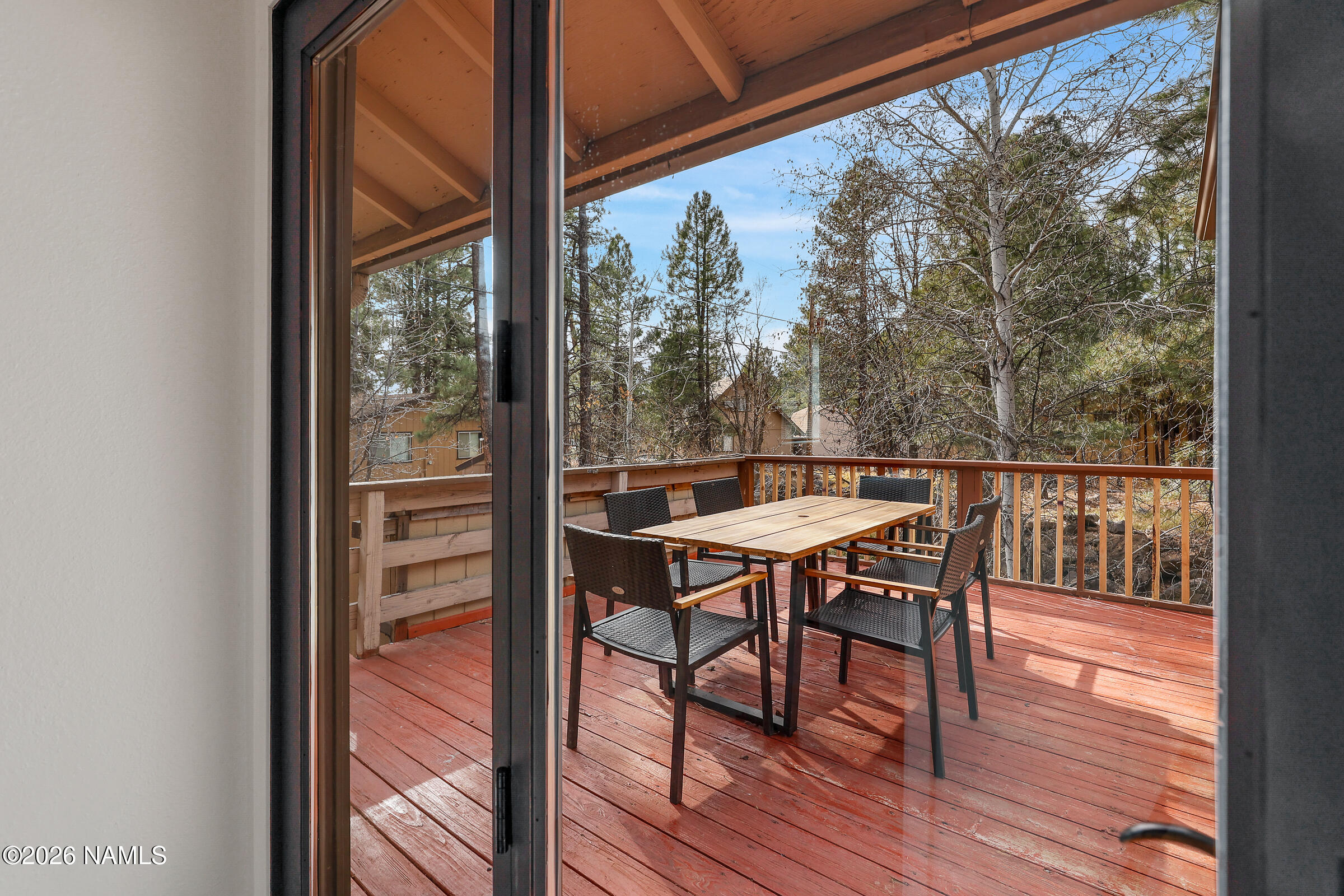 715 Trout Creek Road Munds Park, AZ 86017 - Photo 21 of 46 a view of a chairs and table in the balcony