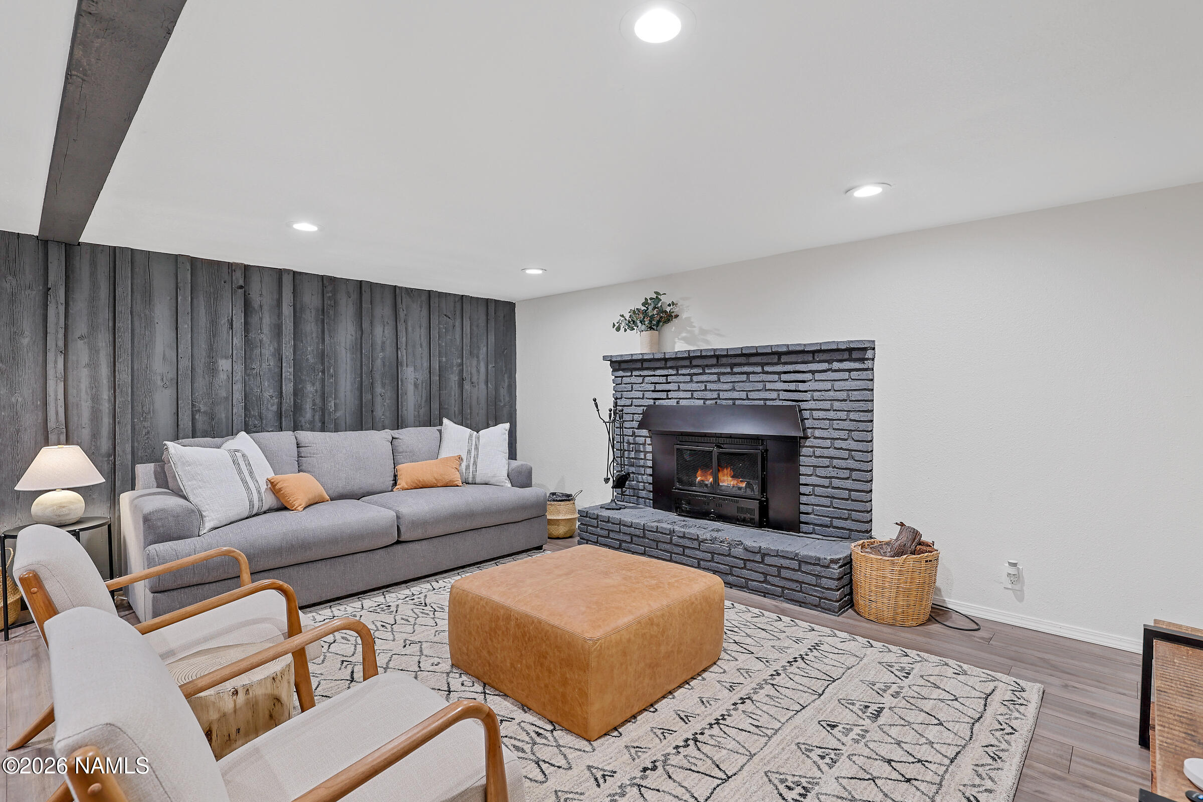 715 Trout Creek Road Munds Park, AZ 86017 - Photo 25 of 46 a living room with furniture and a fireplace