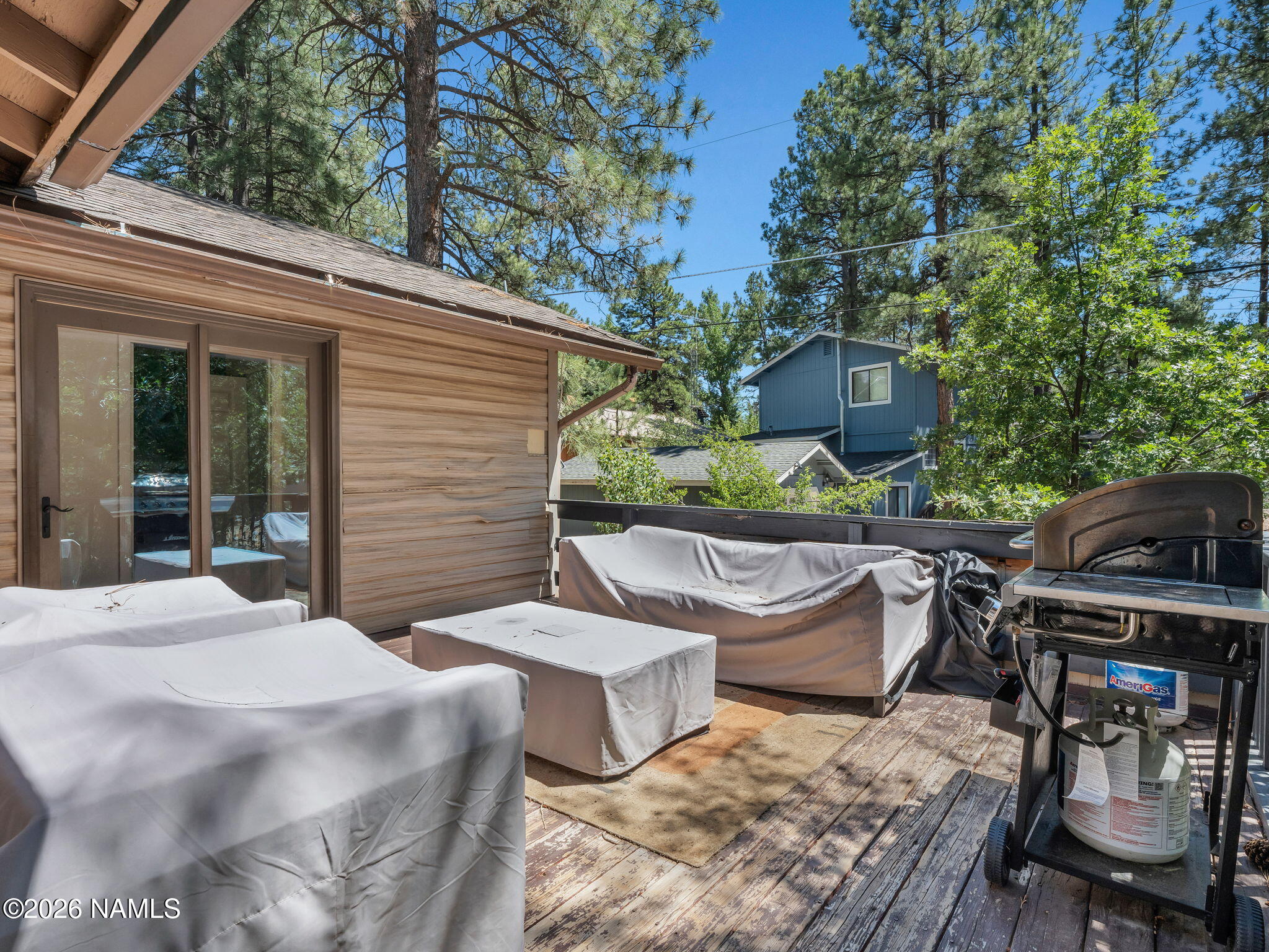 715 Trout Creek Road Munds Park, AZ 86017 - Photo 40 of 46 a view of a patio with two chairs and a table