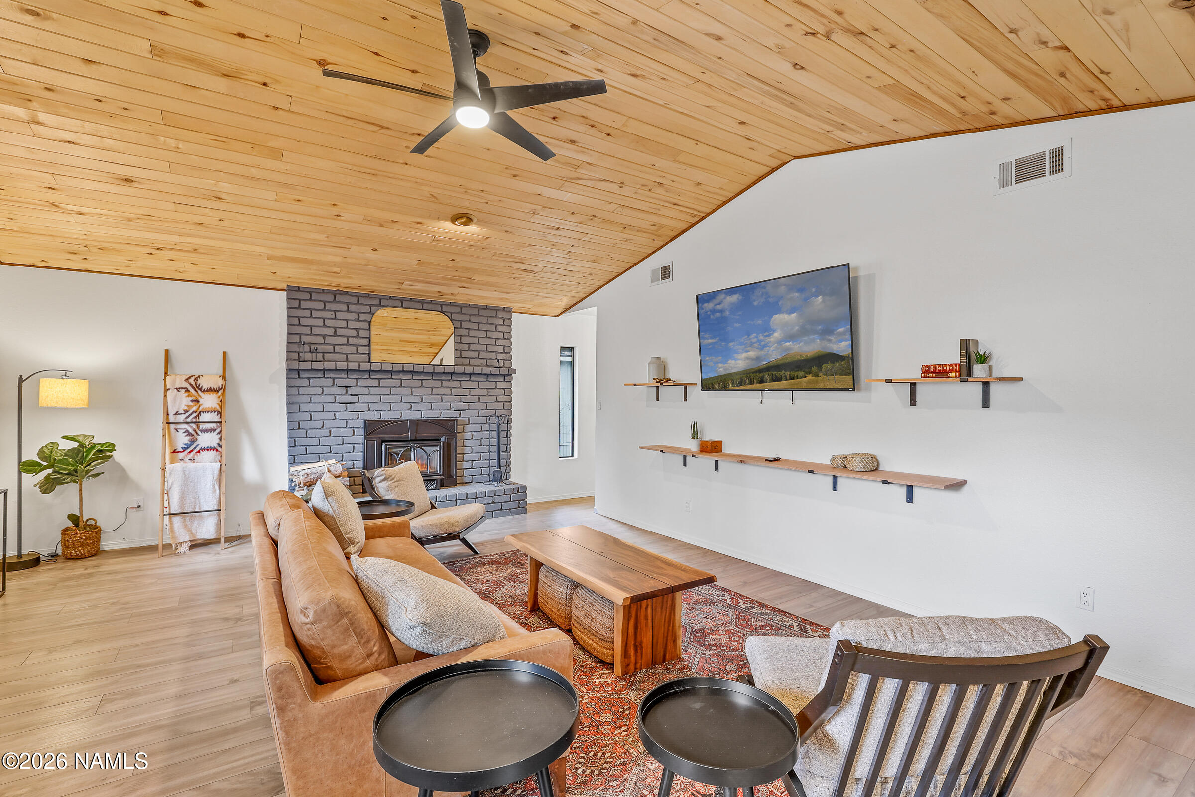 715 Trout Creek Road Munds Park, AZ 86017 - Photo 4 of 46 a living room with furniture and a wooden floor