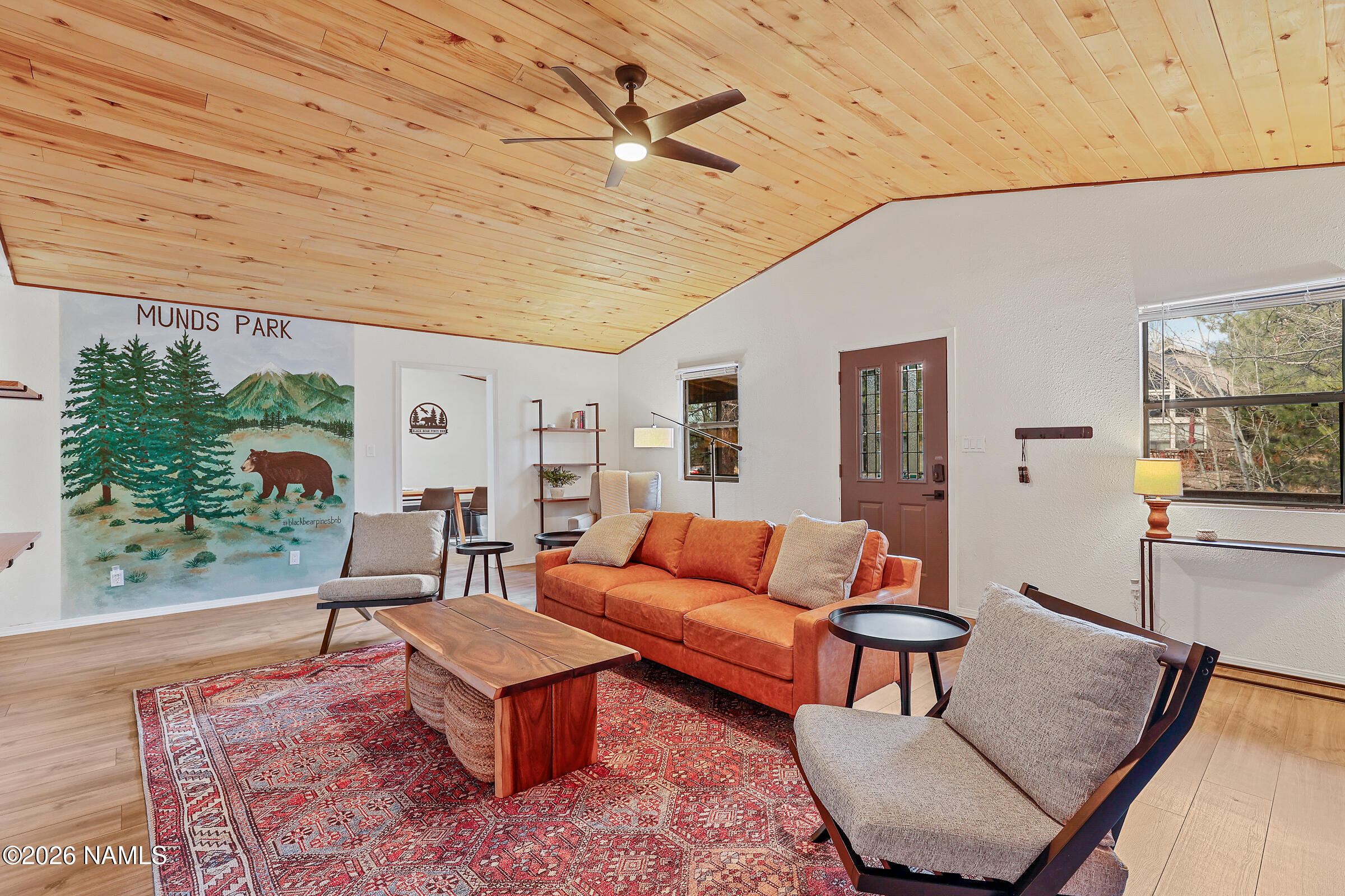715 Trout Creek Road Munds Park, AZ 86017 - Photo 6 of 46 a living room with furniture a rug and a table