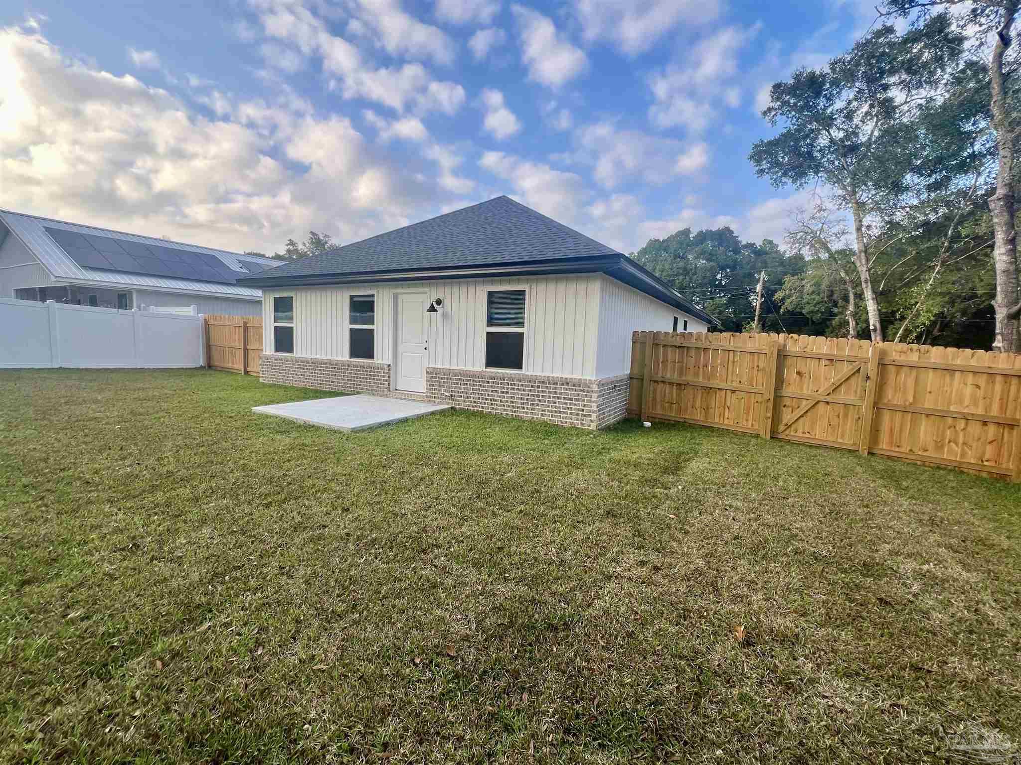 4417 Oak Lane Milton, FL 32583 - Photo 20 of 24 a view of a house with a yard