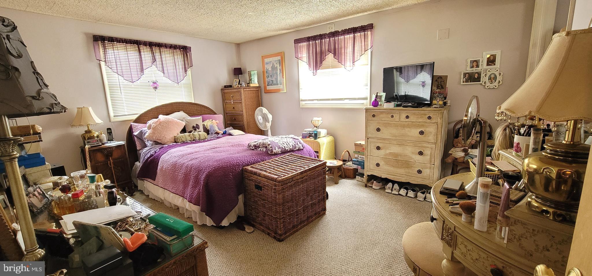 130 Country Lane Buena, NJ 08310 - Photo 18 of 41 a bedroom with a bed couch and a window