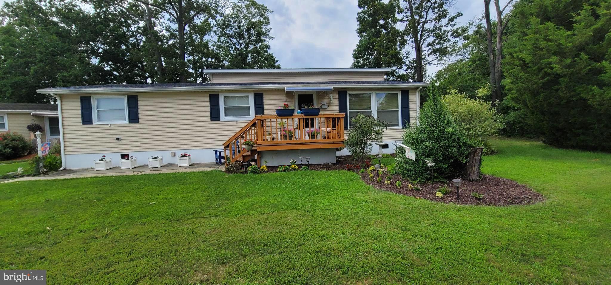 130 Country Lane Buena, NJ 08310 - Photo 2 of 41 a front view of house with yard and green space