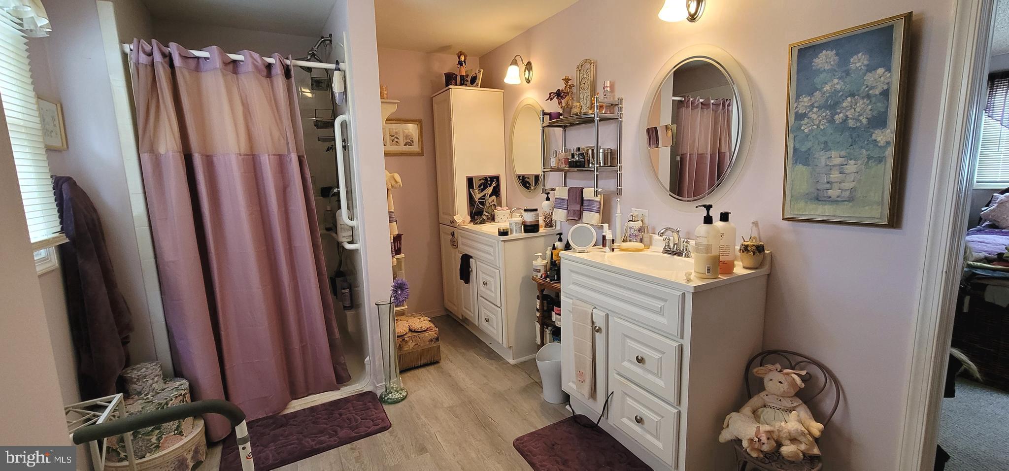 130 Country Lane Buena, NJ 08310 - Photo 21 of 41 a bathroom with sink a mirror a bathtub and shower