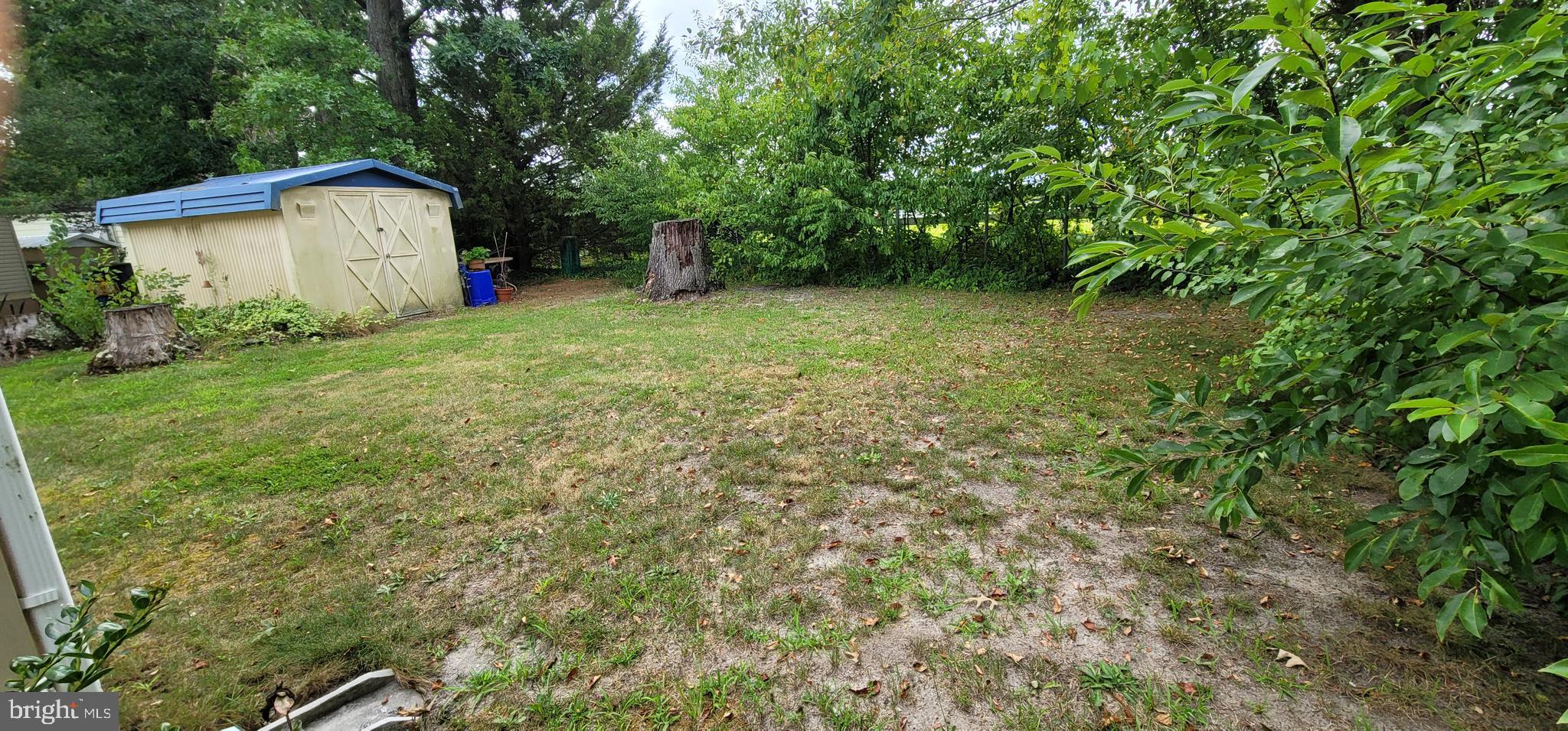 130 Country Lane Buena, NJ 08310 - Photo 24 of 41 a view of a backyard with a garden and entertaining space