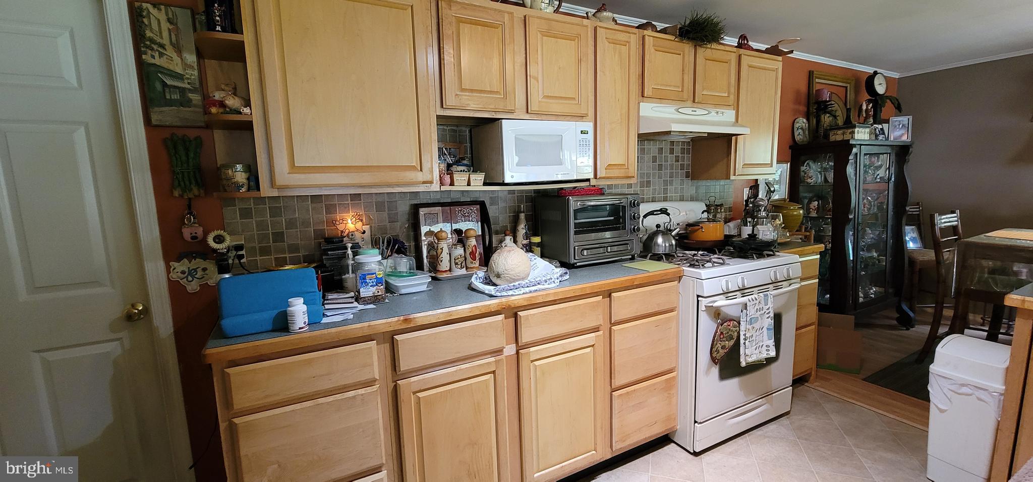 130 Country Lane Buena, NJ 08310 - Photo 7 of 41 a kitchen with white cabinets and white appliances
