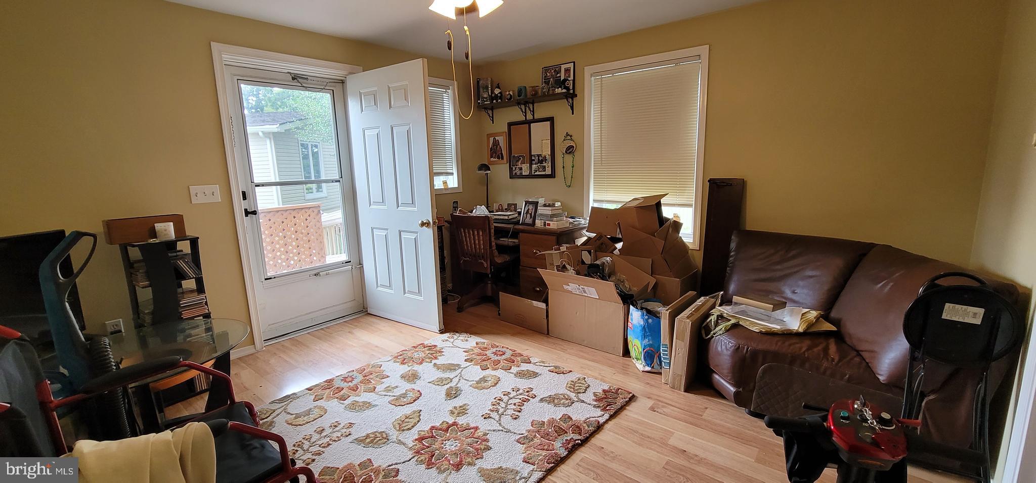 130 Country Lane Buena, NJ 08310 - Photo 9 of 41 a view of a workspace with furniture and a window