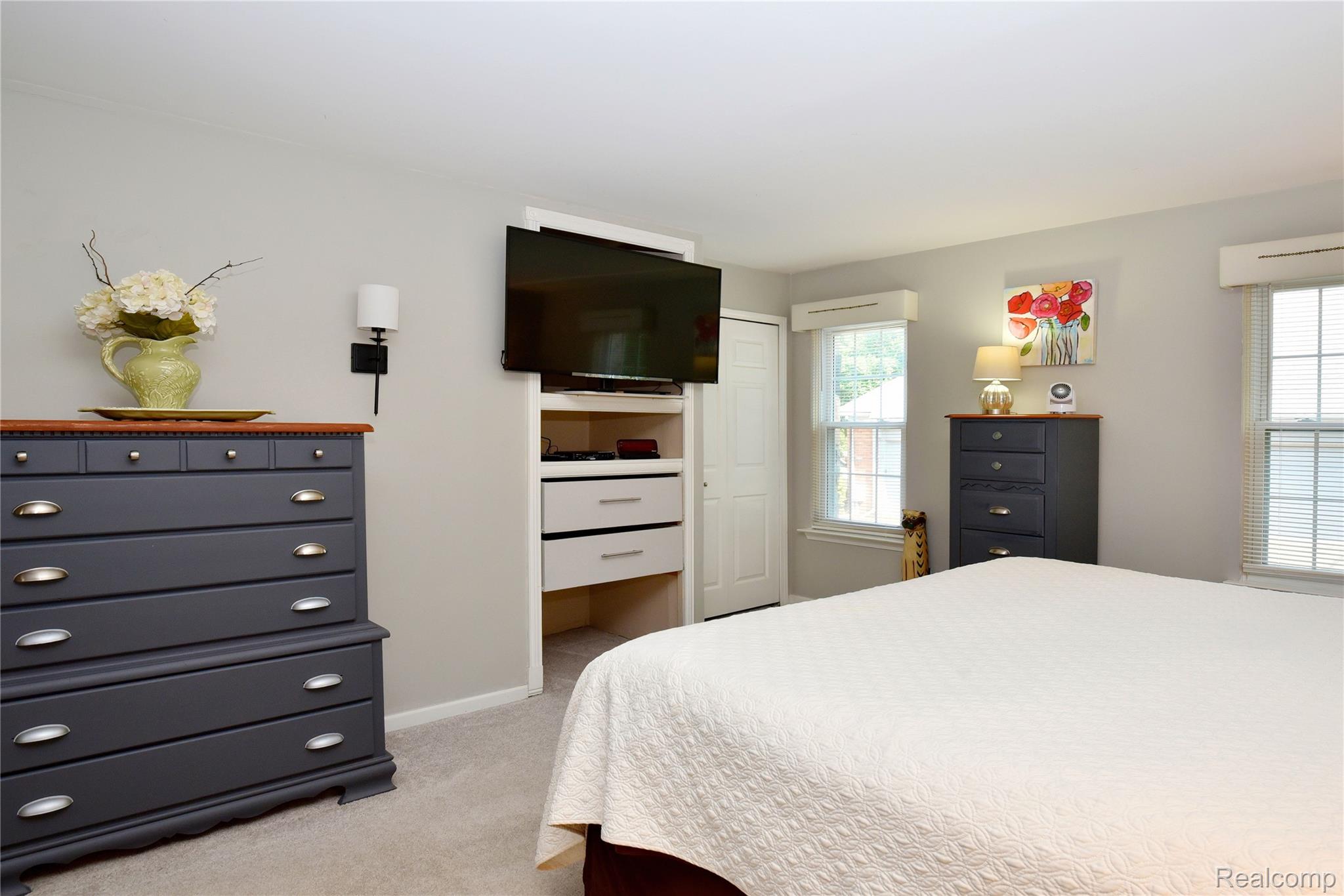 1635 Huntington Park, Unit A Rochester, MI 48309 - Photo 19 of 41 Primary Bedroom - Two Windows and Convenient Build-Ins