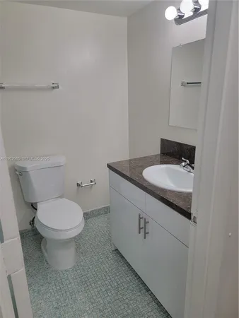 a bathroom with a sink and a toilet