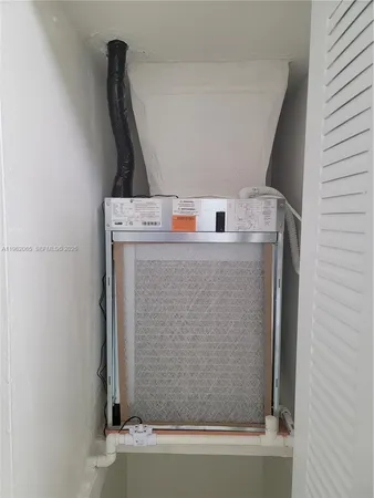 a bathroom with a sink and a washing machine