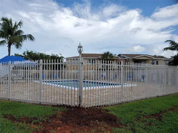a view of a house with swimming pool