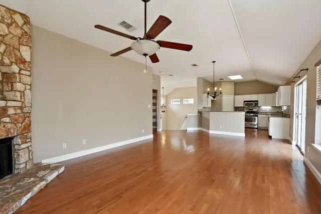 a view of kitchen with furniture and wooden floor