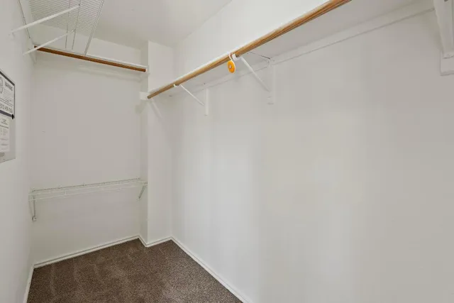 a bathroom with a tub shower and a sink