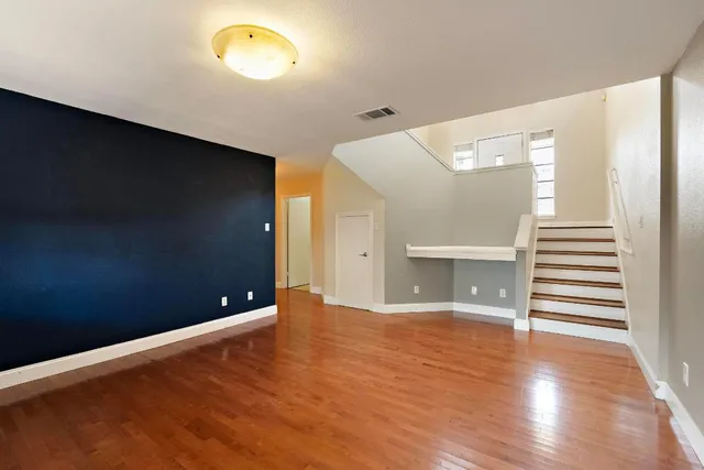 a view of a livingroom with wooden floor