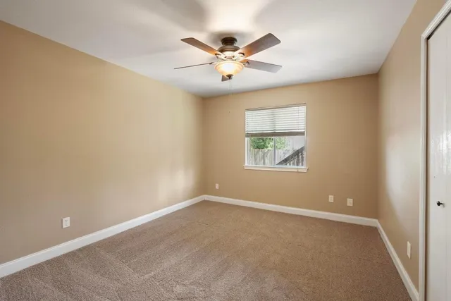 an view of an empty room with a window