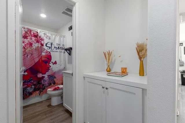 a bathroom with a sink mirror and vanity