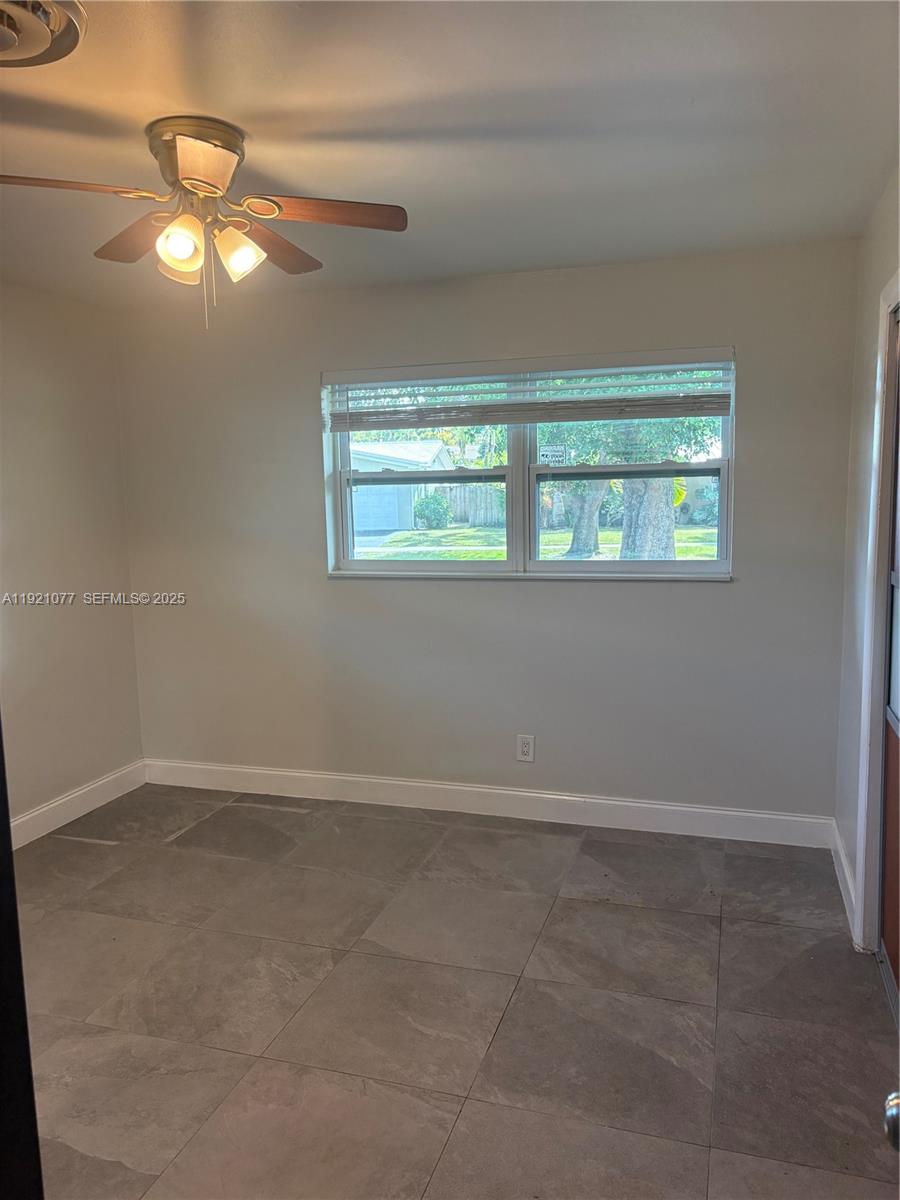 3617 Cleveland Street Hollywood, FL 33021 - Photo 12 of 16 an empty room with a window