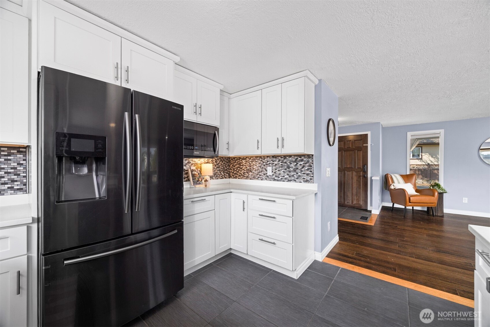 403 17th Street Lynden, WA 98264 - Photo 16 of 40 a kitchen with stainless steel appliances and refrigerator