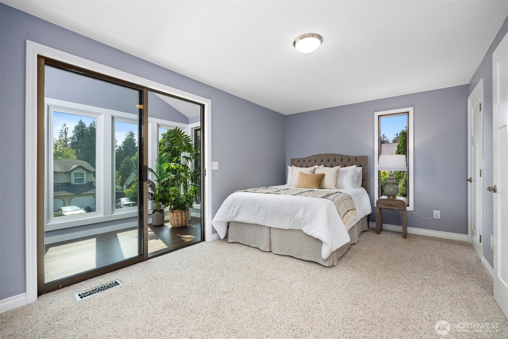 403 17th Street Lynden, WA 98264 - Photo 19 of 40 a bedroom with a large bed and a large window