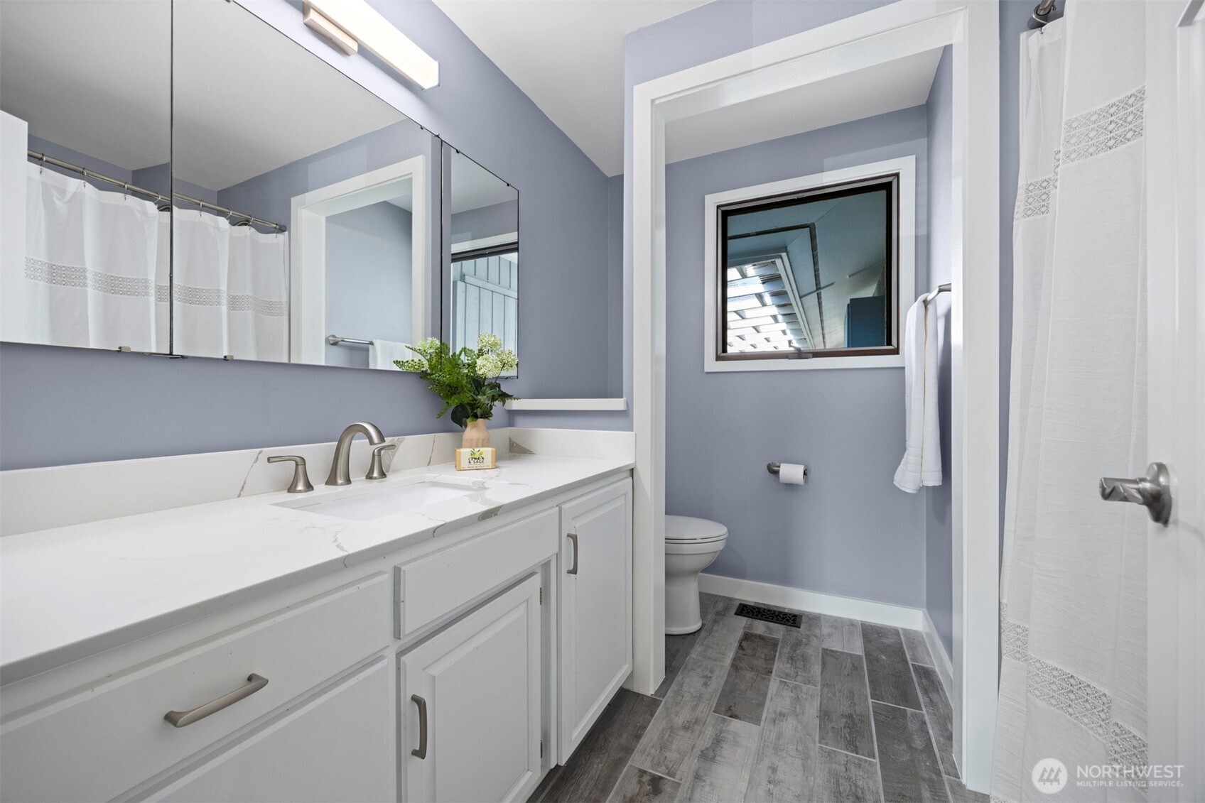 403 17th Street Lynden, WA 98264 - Photo 23 of 40 a bathroom with a sink and a mirror
